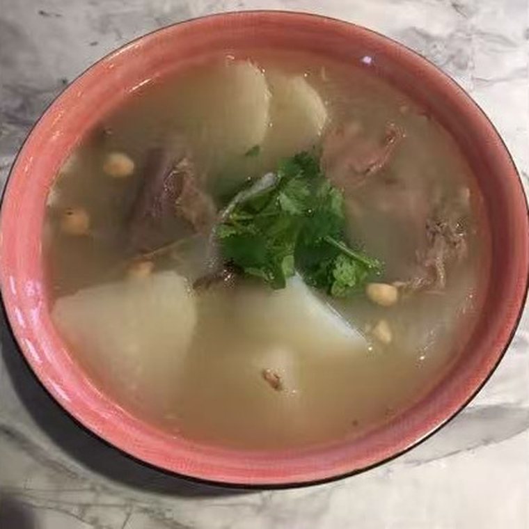 Daikon and beef bone soup with coriander