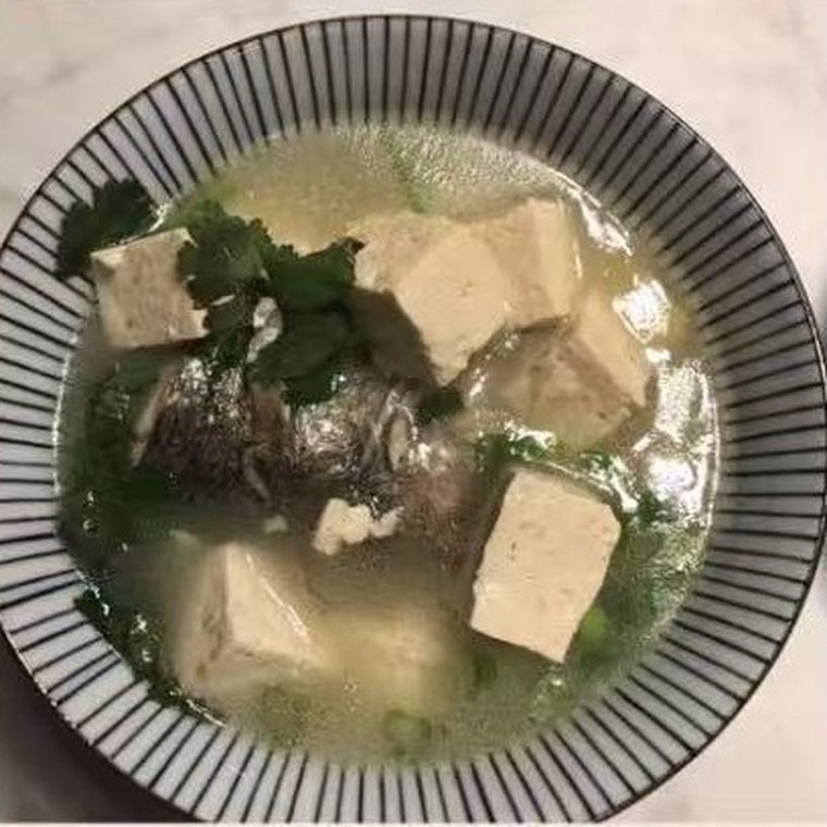Fish and tofu soup with coriander