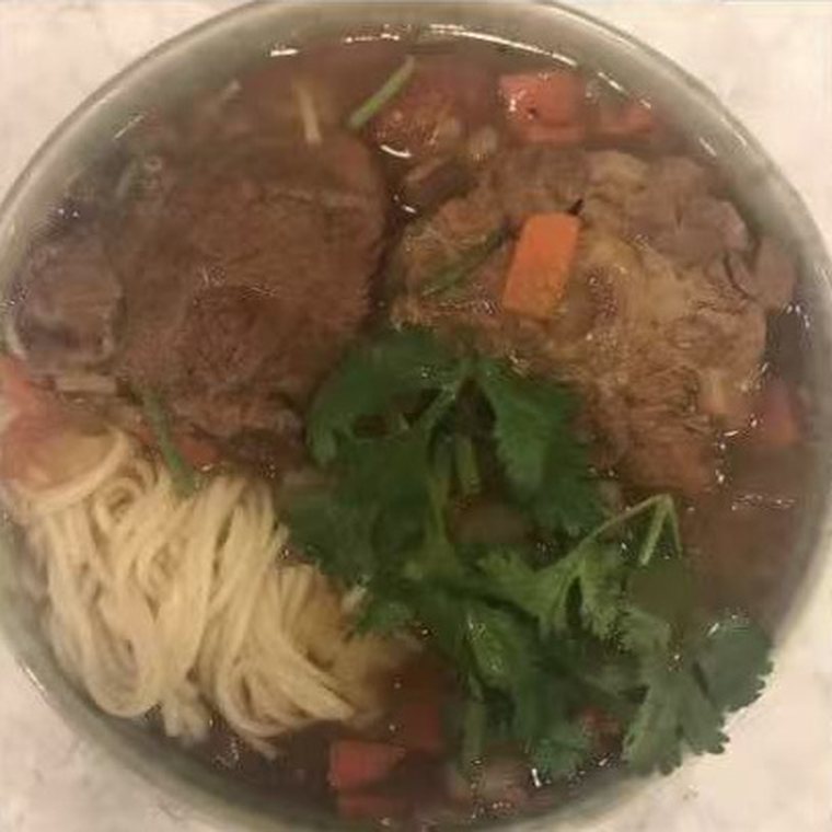 Beef noodle soup with coriander